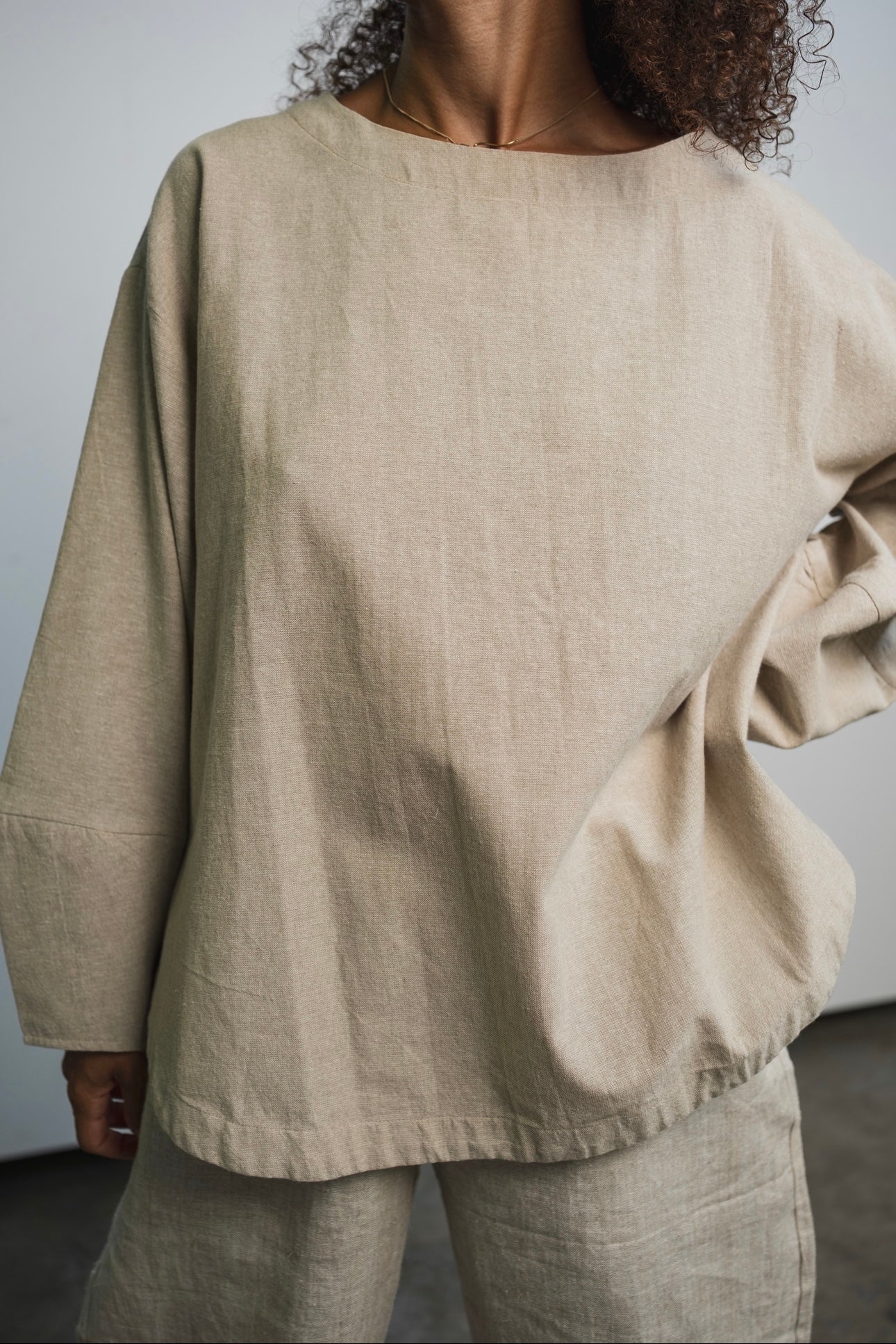 Ash organic handwoven cotton long sleeve top with oversized fit and round neckline
