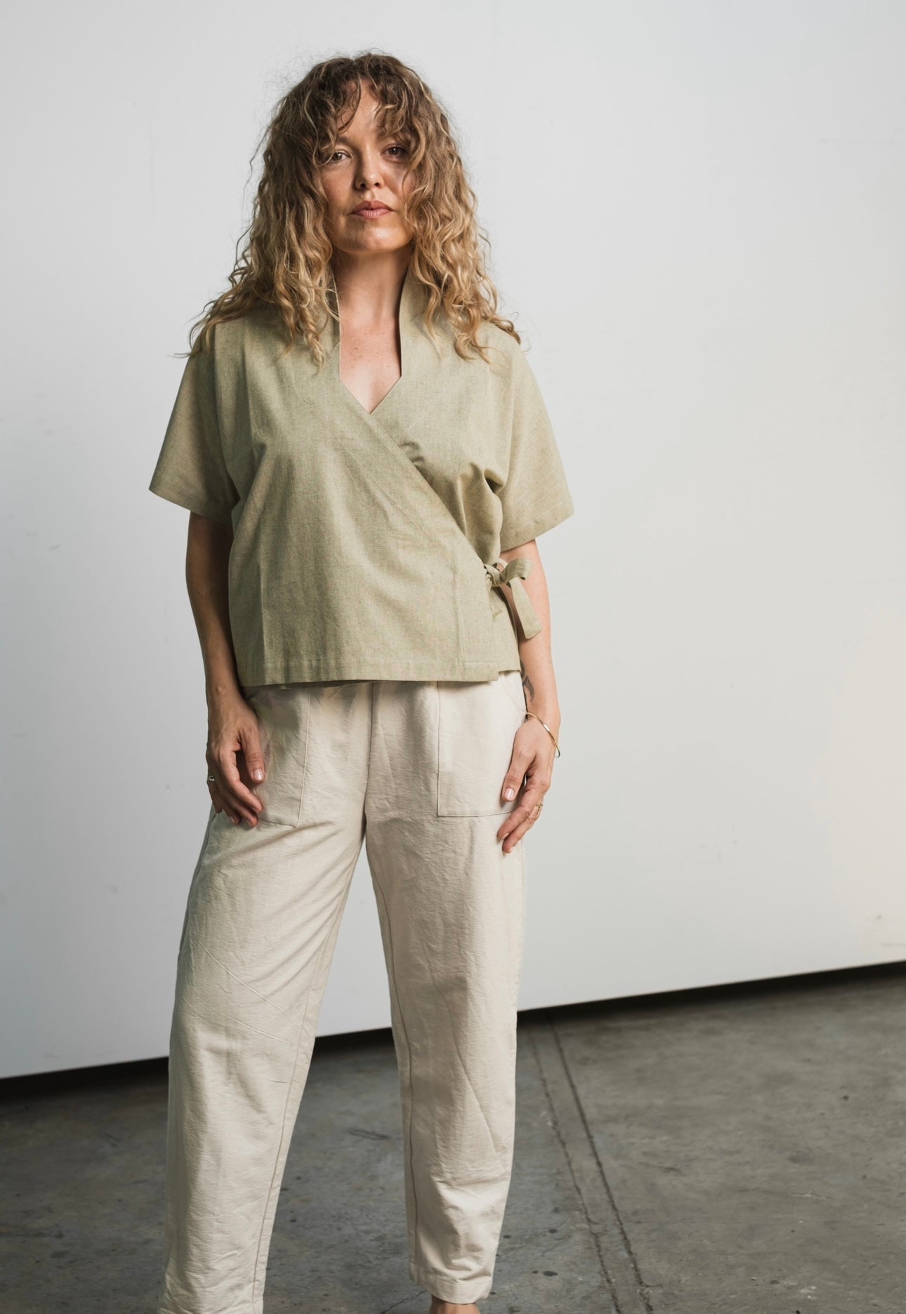 Japanese-inspired wrap garment with V-neck design and adjustable layered fit
