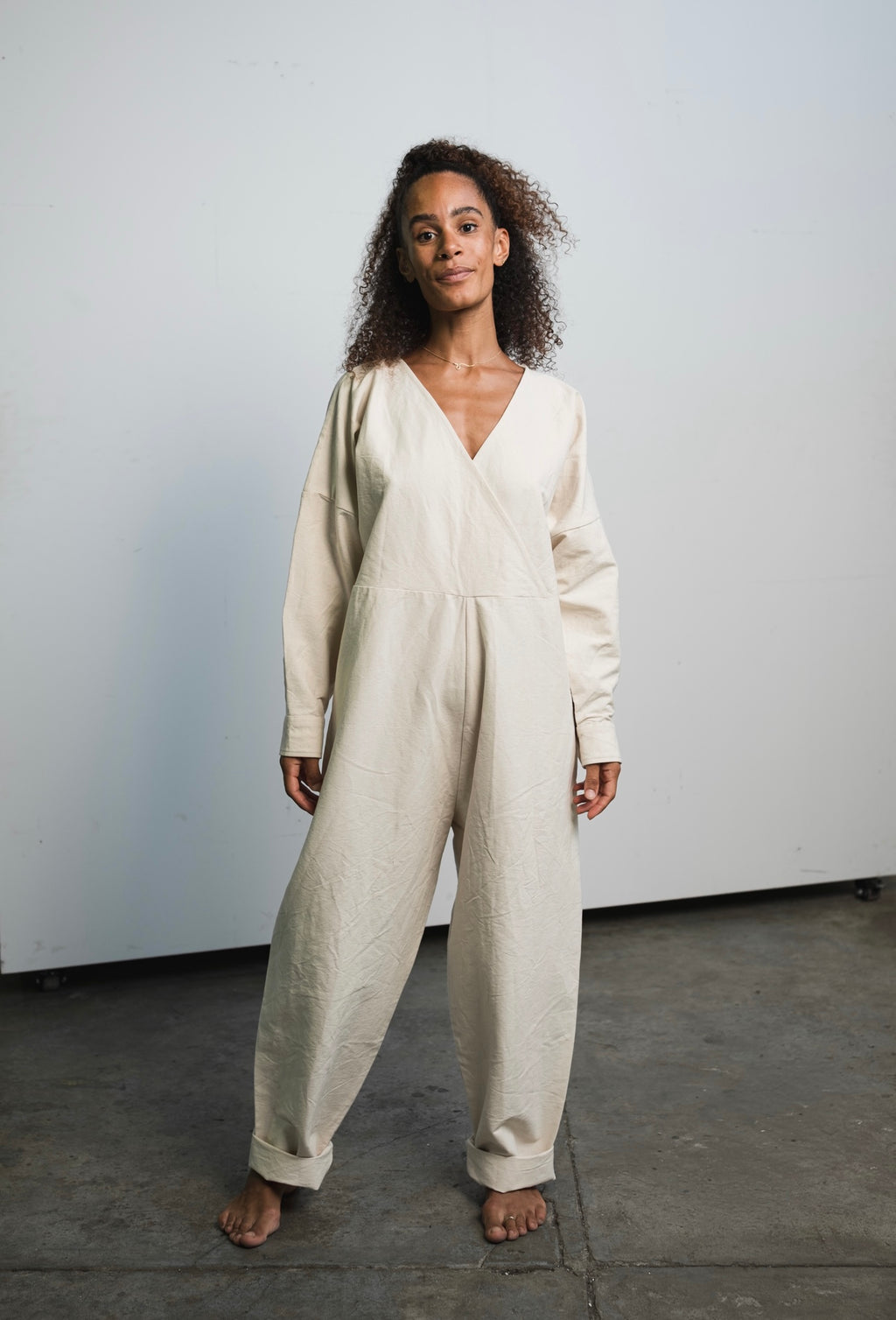 Oversized raw undyed cotton canvas jumpsuit with relaxed everyday fit

