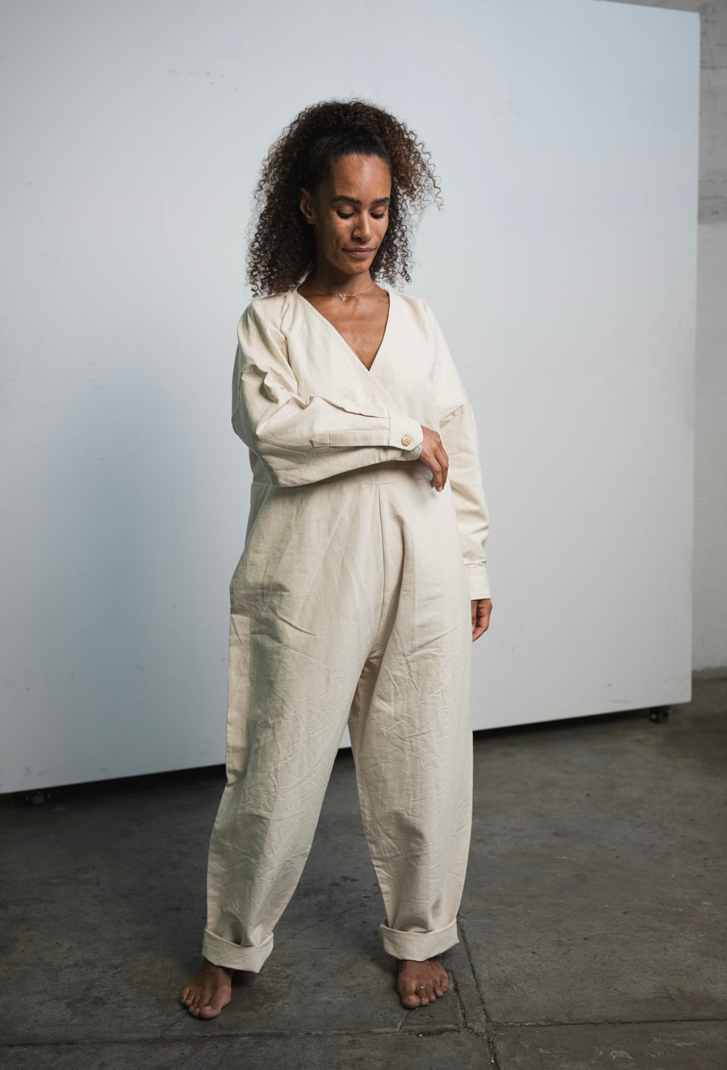 Oversized raw undyed cotton canvas jumpsuit with relaxed everyday fit
