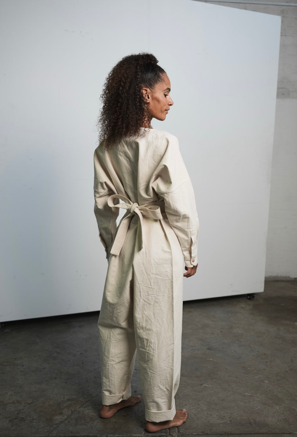 Oversized raw undyed cotton canvas jumpsuit with relaxed everyday fit
