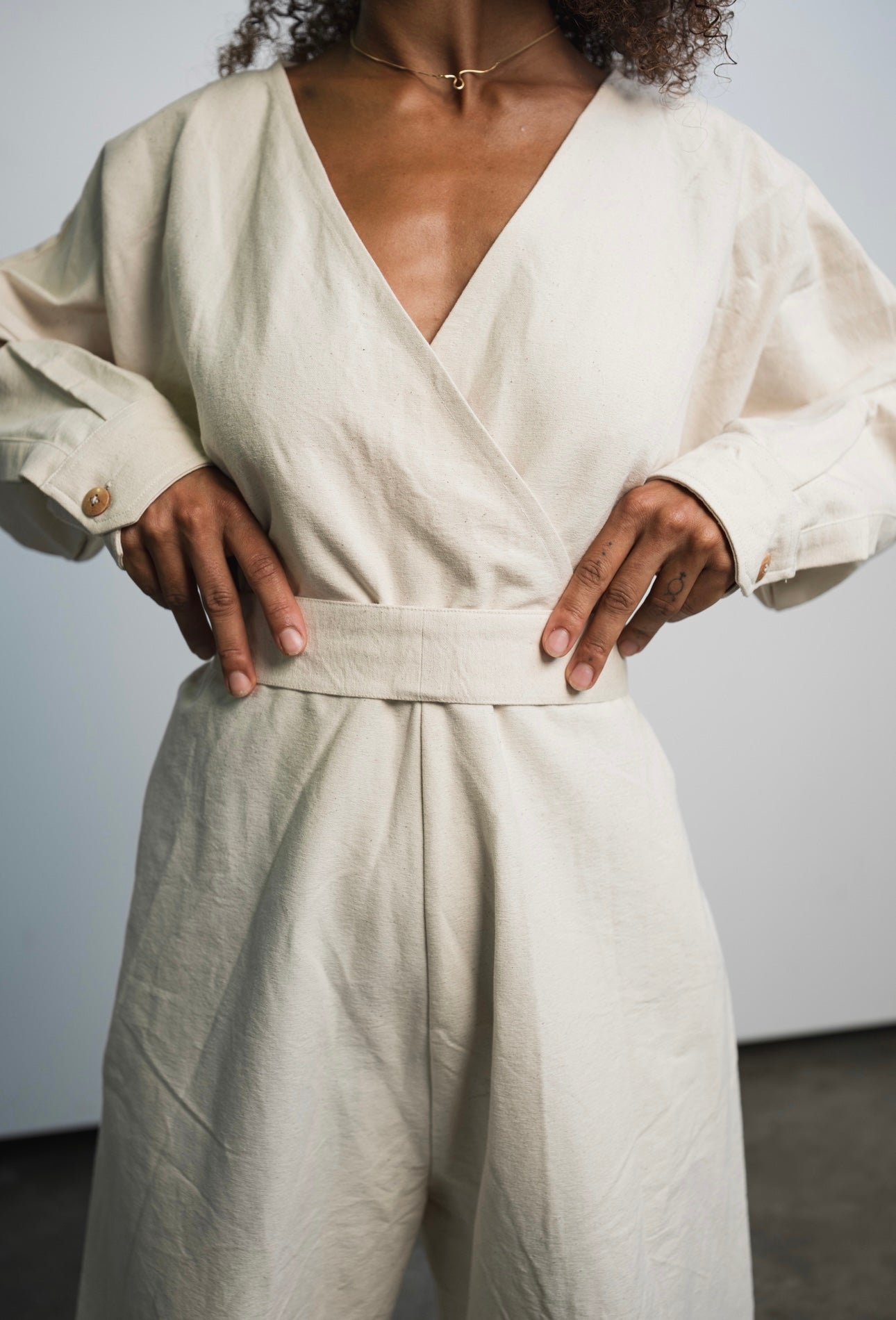 Oversized raw undyed cotton canvas jumpsuit with relaxed everyday fit
