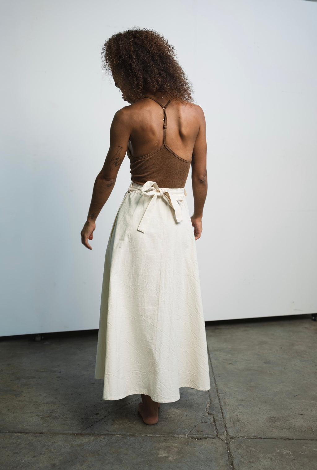 Cotton canvas skirt with elastic waistband, ribbon tie, and double-layer fabric
