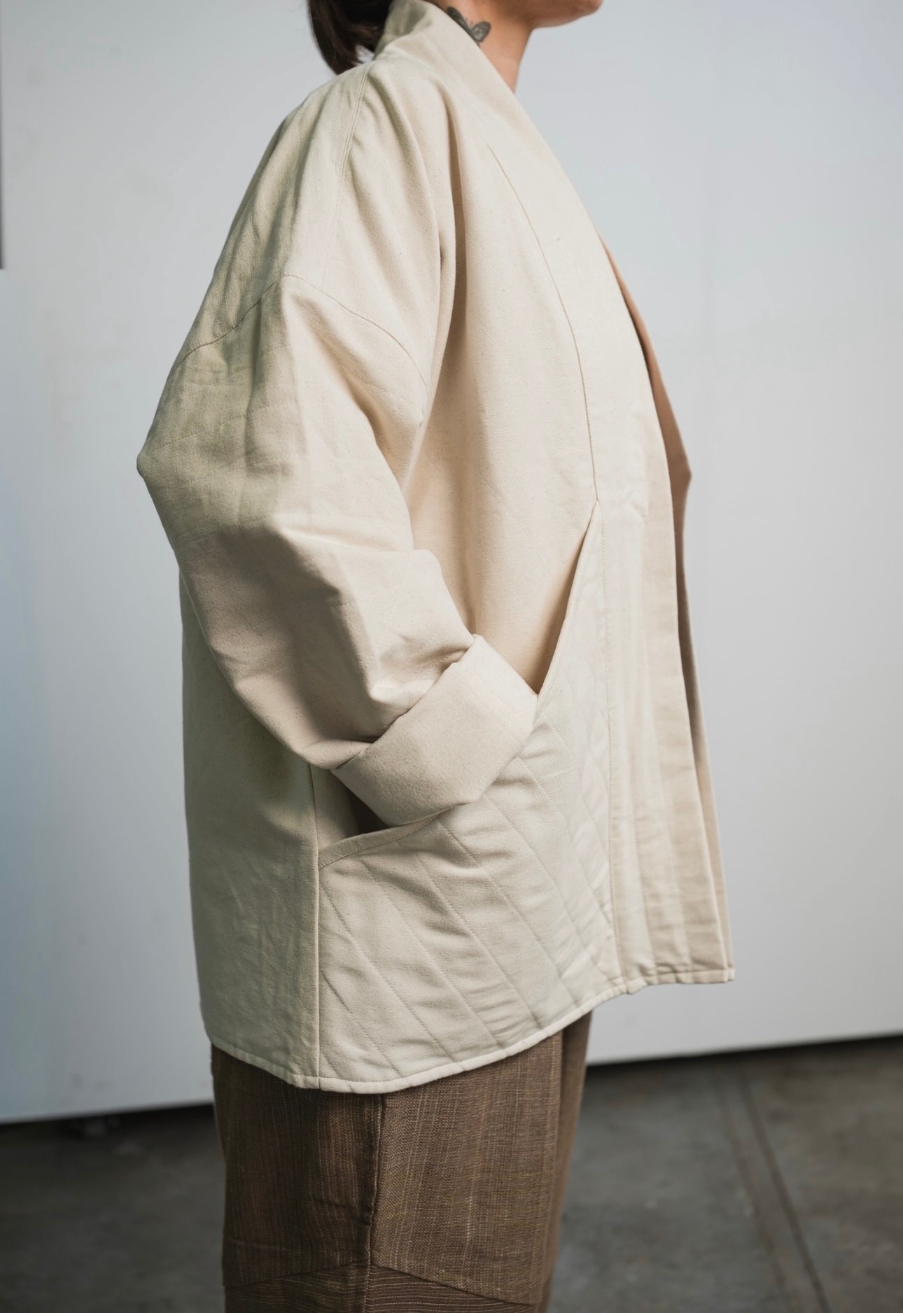 Three-layer raw cotton canvas blazer jacket by Devine with undyed natural finish and diagonal pockets